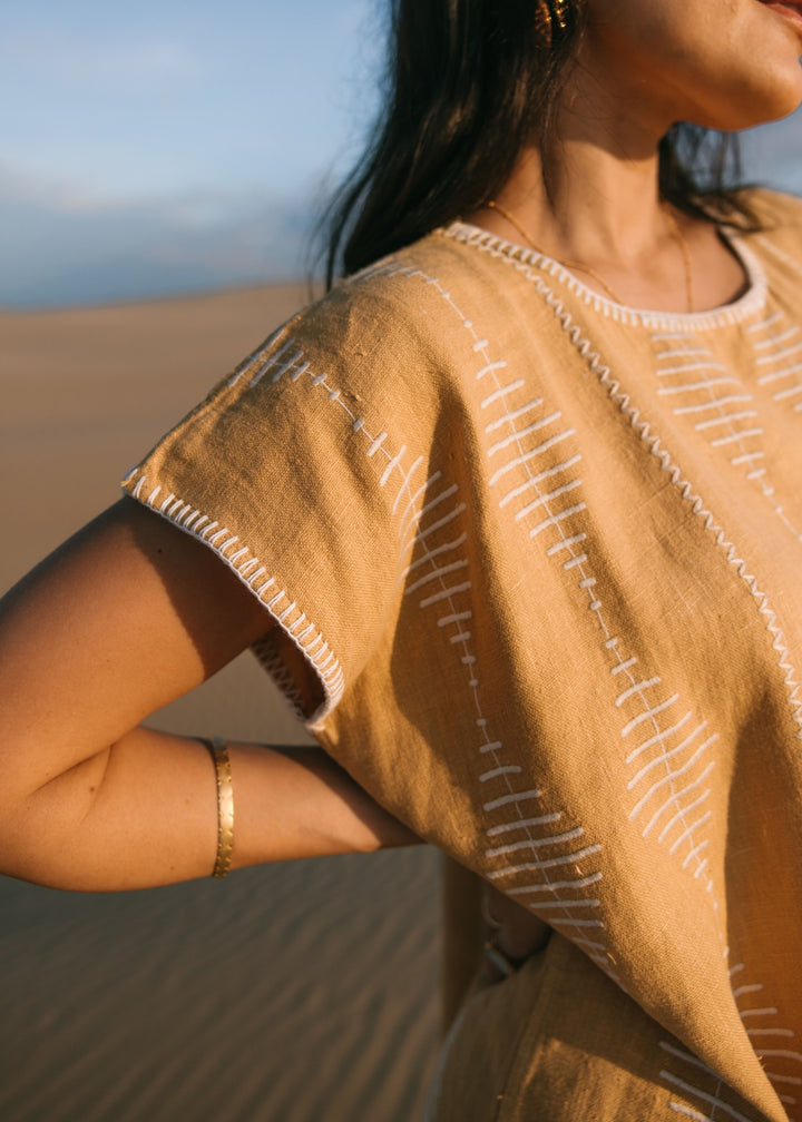 Artisanal honey-toned Frida Kaftan in breathable linen, designed for effortless resortwear by Ulu Lounge."