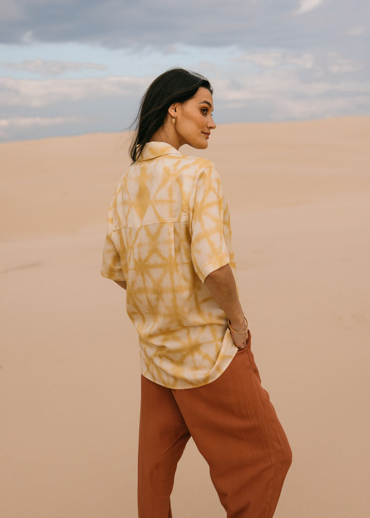 Relaxed fit biscotti shibori shirt made with eco-friendly Tencel fabric, perfect for effortless resort style."